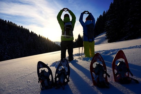 Snowshoe hikers form a heart on the Saukogel