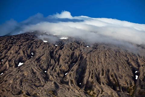 Volcano and glacier Snaefellsjokull with summit in clouds