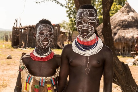 Two young girls with face painting