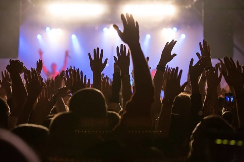 Fans in the audience cheering during the concert of the German-Lebanese rapper MoTrip live at the Schuur
