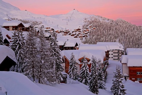 Village view snow-covered at dusk