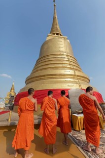 Buddhist monks in front of the Chedi on Phu Khao Thong