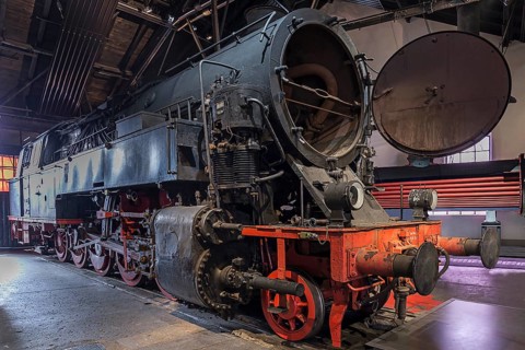 Tender locomotive 95 016 with open smoke chamber in a former railway depot