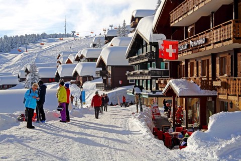 Village road with snow-covered houses
