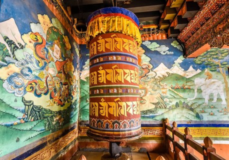 Prayer mill and mural painting in the monastery fortress