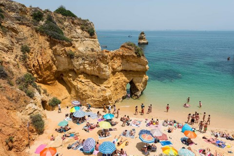 Tourists and bathers at the sandy beach