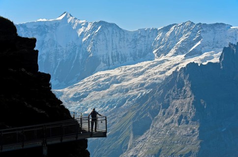 Tourist on the First Cliff Walk by Tissot in front of the Fiescherhorn north face and the Grindelwald glacier
