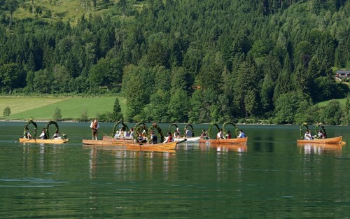 Men wearing traditional costumes in festively decorated squares