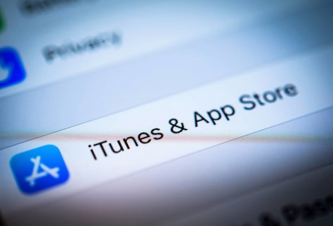ITunes and App Store Settings displayed on an iPhone