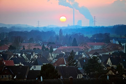 Housing estate with the Gersteinwerk power plant at sunset