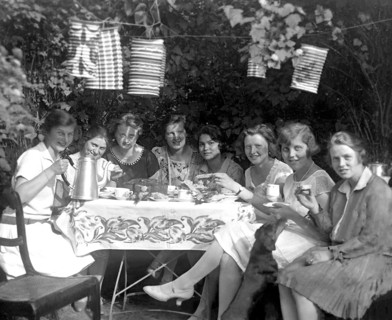Eight women at a coffee party in the garden