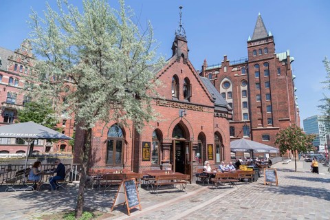 Fleetschlosschen in front of old warehouses in the Speicherstadt