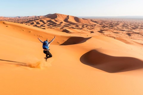 Woman running downhill