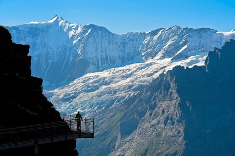 Tourist on the First Cliff Walk by Tissot in front of the Fiescherhorn north face and the Grindelwald glacier