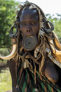 Woman with lip plate and headdress