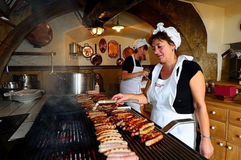 Sausages sizzle on the grill