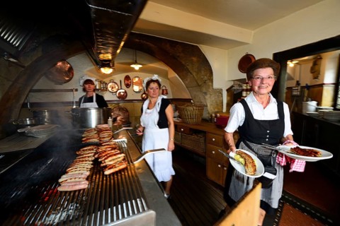 Sausages sizzle on the grill