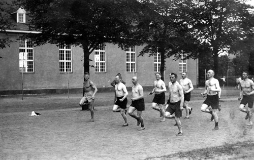 Men jogging with naked torsos