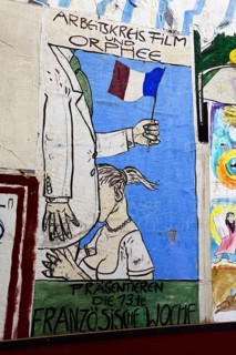 Billboard in the backyard of the Cafe Orphee