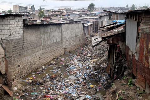 Garbage between corrugated-iron huts