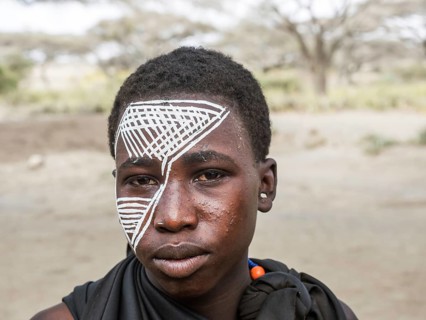 Young Massai warrior with face painting