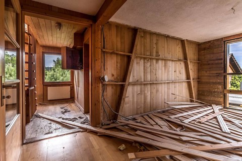 A room paneled with wood in a house that will be demolished