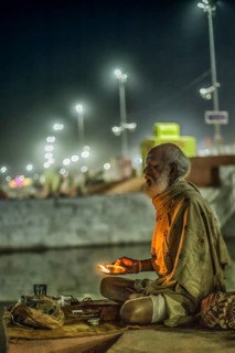 Pilgrim with oil lamp during Hindu festival Kumbh Mela