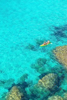 People canoeing at Cala Mitjana
