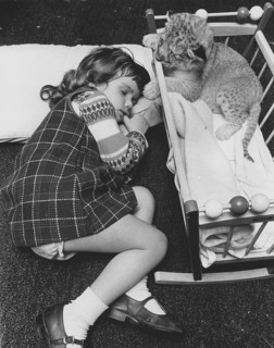Girl sleeping next to a baby predator