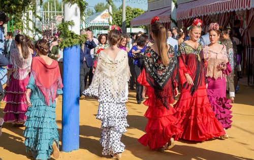 Spanish women with colorful flamenco dresses