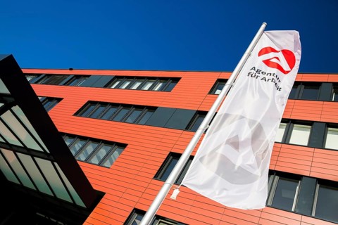 Flag in front of the new building of the Employment Agency