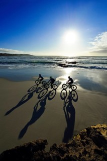 Mountain bikers with Fatbikes at the sandy beach