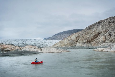 Man with Packraft on river
