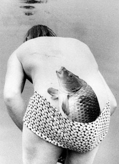 Man with fish in swimsuit ca. 1970s