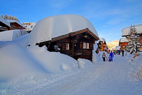 Village road with snow-covered chalets