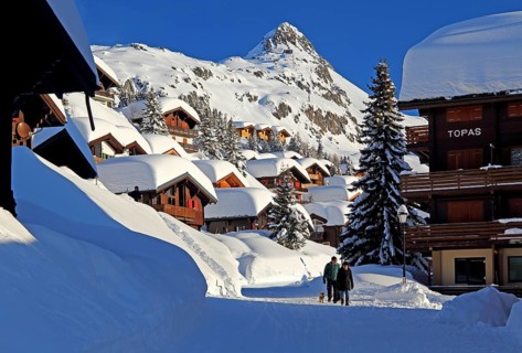 Village road with snow-covered chalets