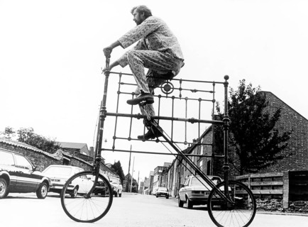 Man on curious big bike