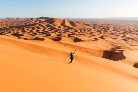 Woman running downhill