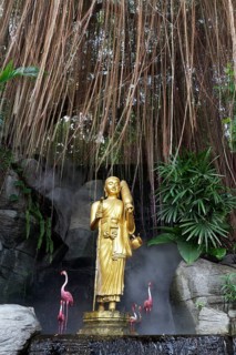 Buddha statue and artificial flamingos