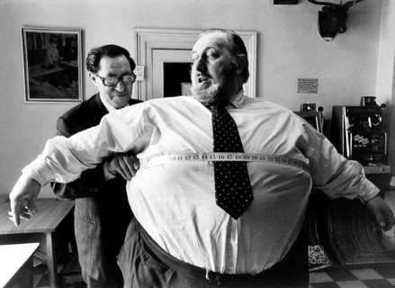 Thick man is measured by the tailor