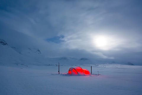 Tent by full moon in the snow