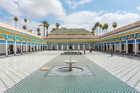 Ornate courtyard with columns and fountain