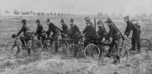 Belgian soldiers riding bikes in the countryside
