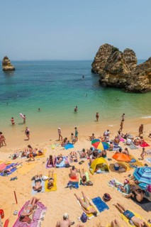 Tourists and bathers at the sandy beach