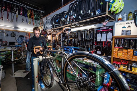 Man repairs bicycle