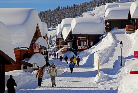 Village road with snow-covered chalets