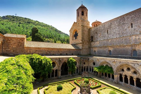 Cloister and well at the Abbaye Sainte-Marie de Fontfroide or Fontfroide Abbey near Narbonne