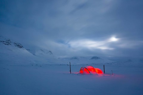 Tent by full moon in the snow
