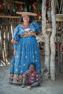 Native Herero woman with typical headgear and clothes and child