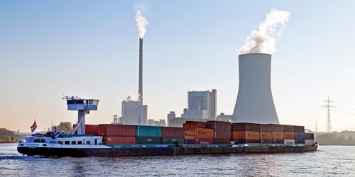 Container ship on the Rhine in front of the Duisburg-Walsum power station